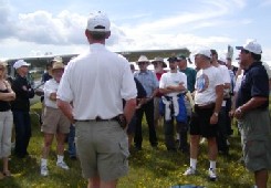 Rodney addressing the crew during the post-arrival debriefing in 2006.
