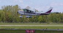 Jim Andres landing his Stationair on Rwy. 28 at Port Huron during formation training in 2006.